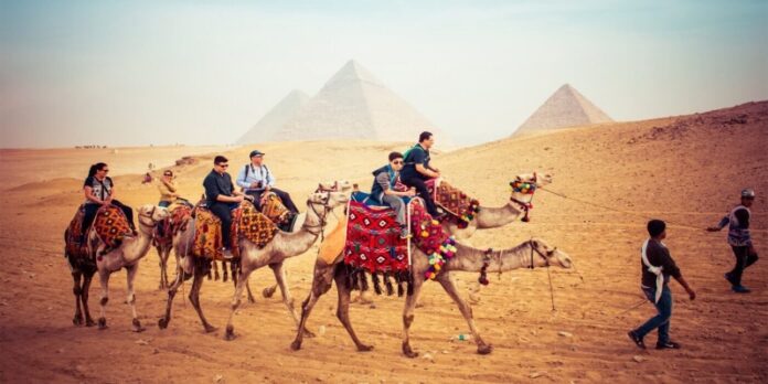 618808234_Riding Camels In Egypt